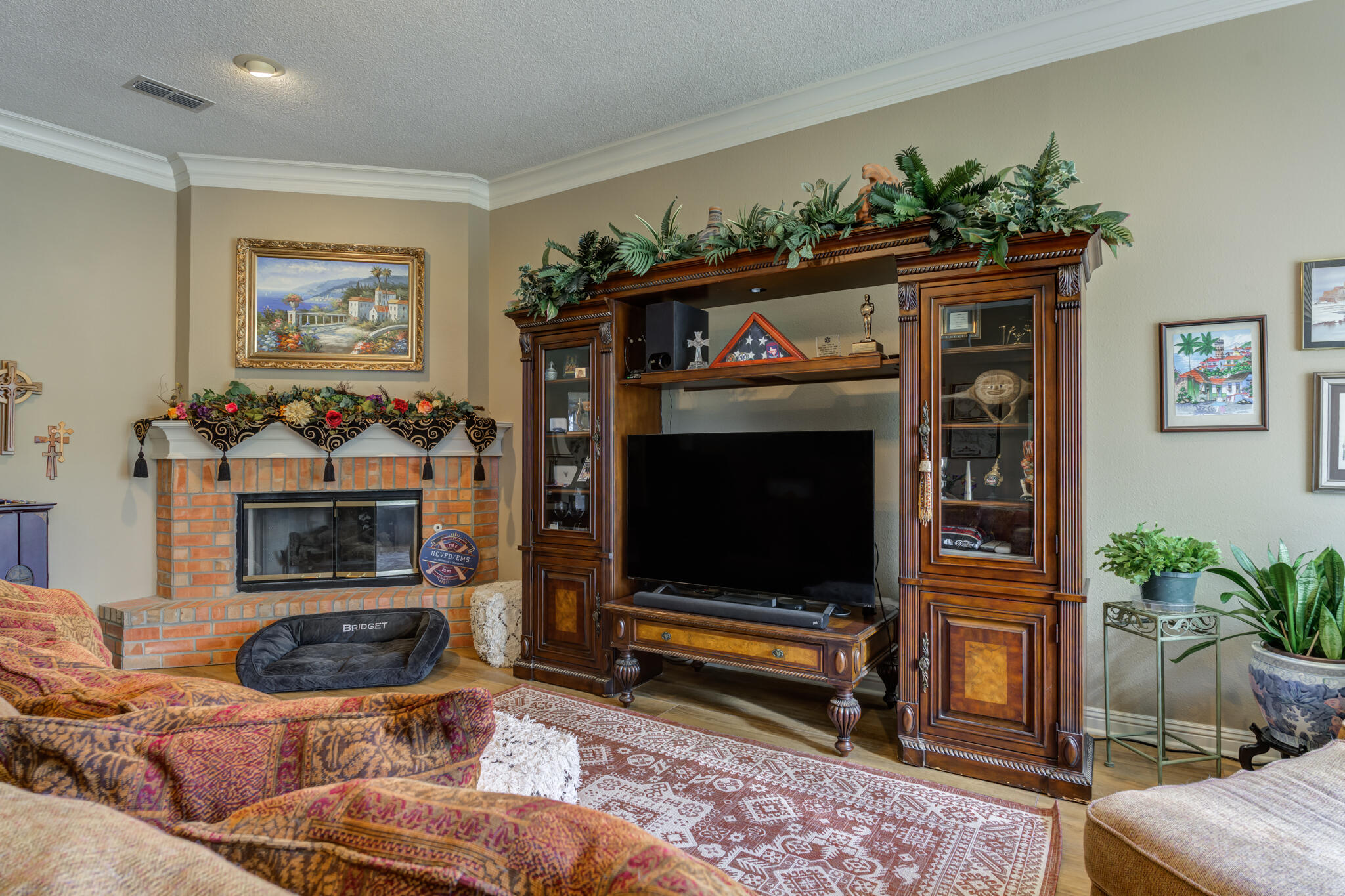 30 West Lakeshore Drive Ransom Canyon, TX 79366 - Photo 8 of 58 a living room with furniture a flat screen tv and a fireplace