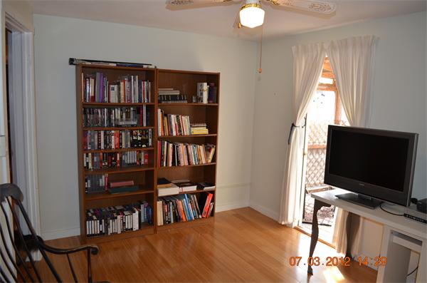 119 Thresher Road Hampden, MA 01036 - Photo 15 of 22 a view of a livingroom with furniture and a flat screen tv