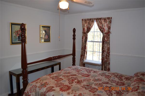 119 Thresher Road Hampden, MA 01036 - Photo 17 of 22 a bedroom with a bed and a window