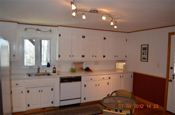 119 Thresher Road Hampden, MA 01036 - Photo 3 of 22 a kitchen with granite countertop a sink cabinets and wooden floor