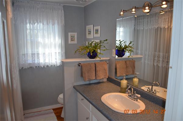 119 Thresher Road Hampden, MA 01036 - Photo 10 of 22 a bathroom with a sink toilet and a mirror