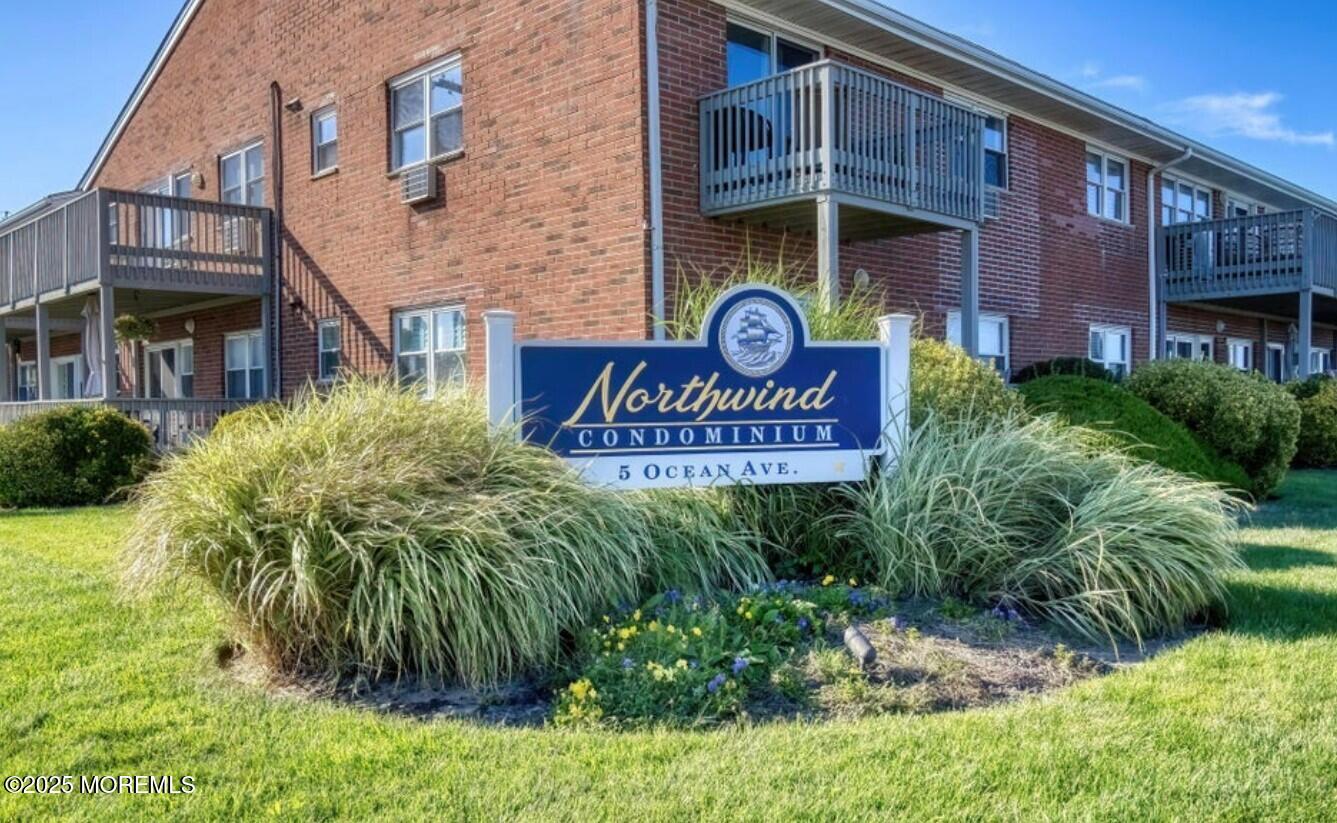 5 Ocean Avenue, Unit 5B Belmar, NJ 07719 - Photo 1 of 13 a sign on the side of a building