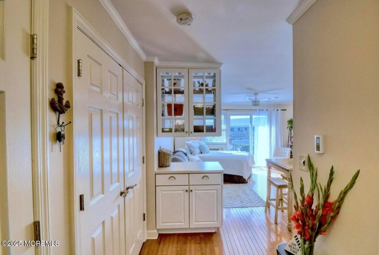 5 Ocean Avenue, Unit 5B Belmar, NJ 07719 - Photo 3 of 13 a living room with furniture and wooden floor
