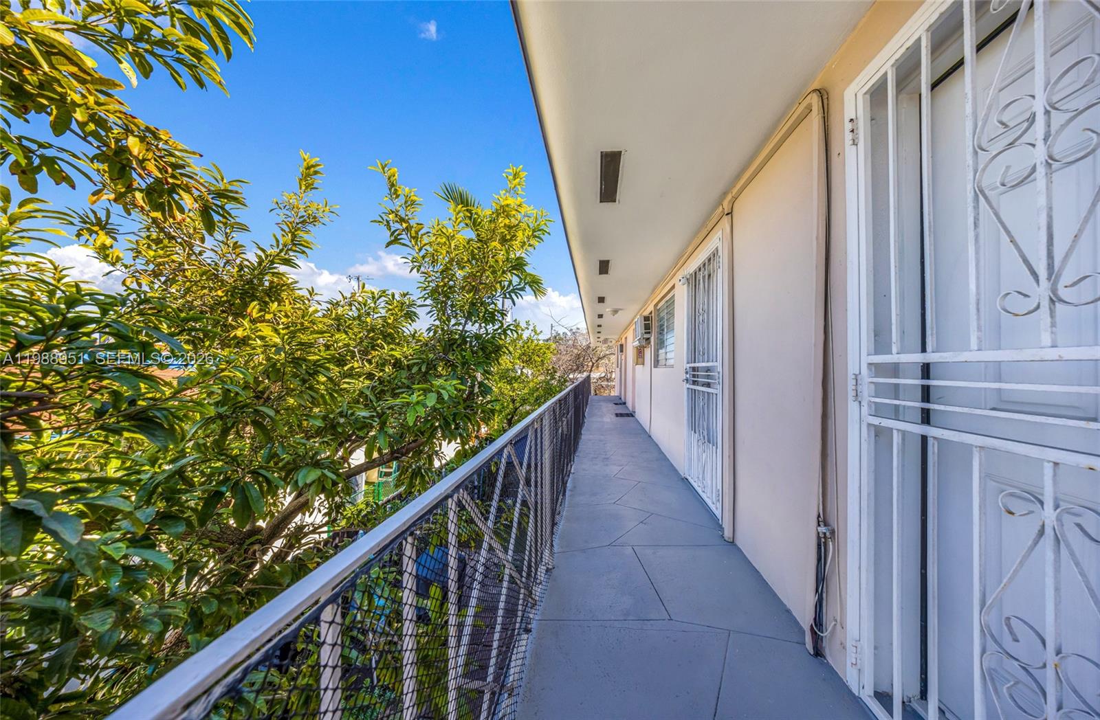605 Northwest 34th Avenue Miami, FL 33125 - Photo 12 of 49 a side view of a house with wooden stairs