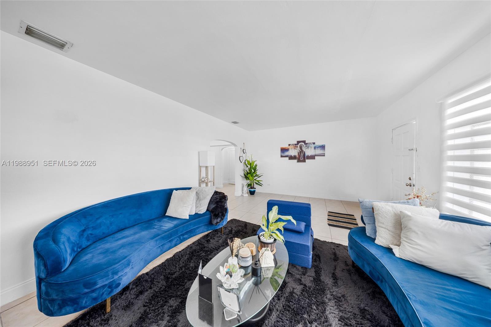 605 Northwest 34th Avenue Miami, FL 33125 - Photo 15 of 49 a living room with furniture and wooden floor