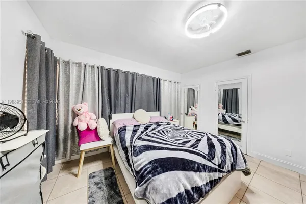 a bathroom with a toilet a sink and a shower