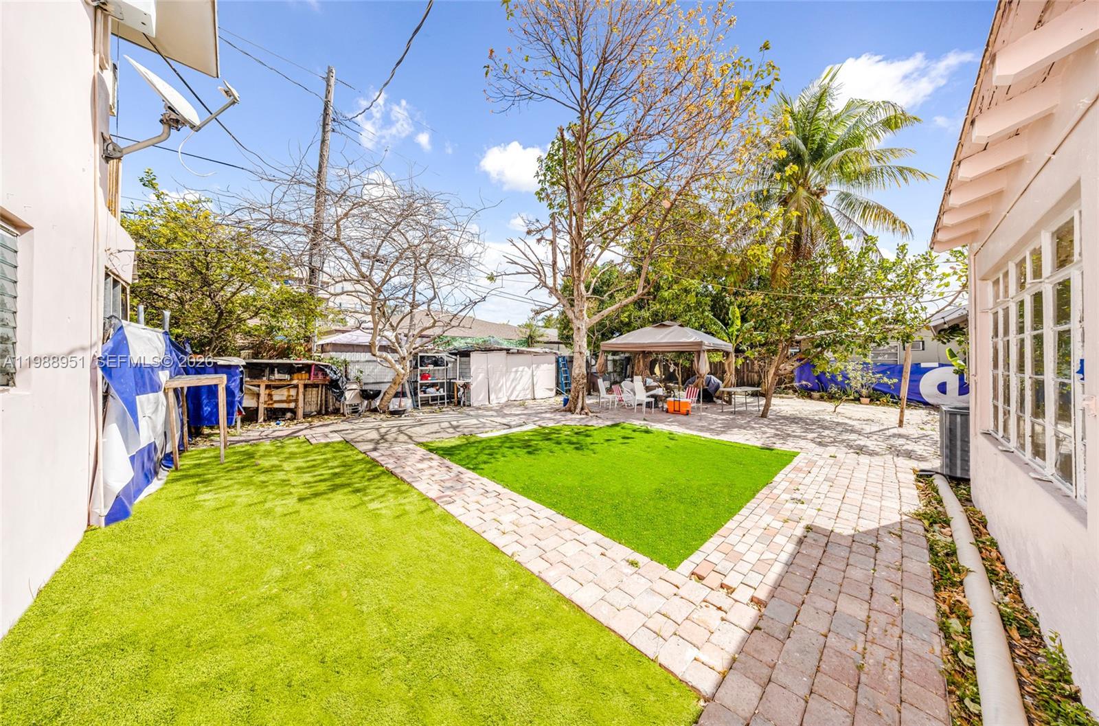 605 Northwest 34th Avenue Miami, FL 33125 - Photo 30 of 49 a view of a swimming pool with a patio