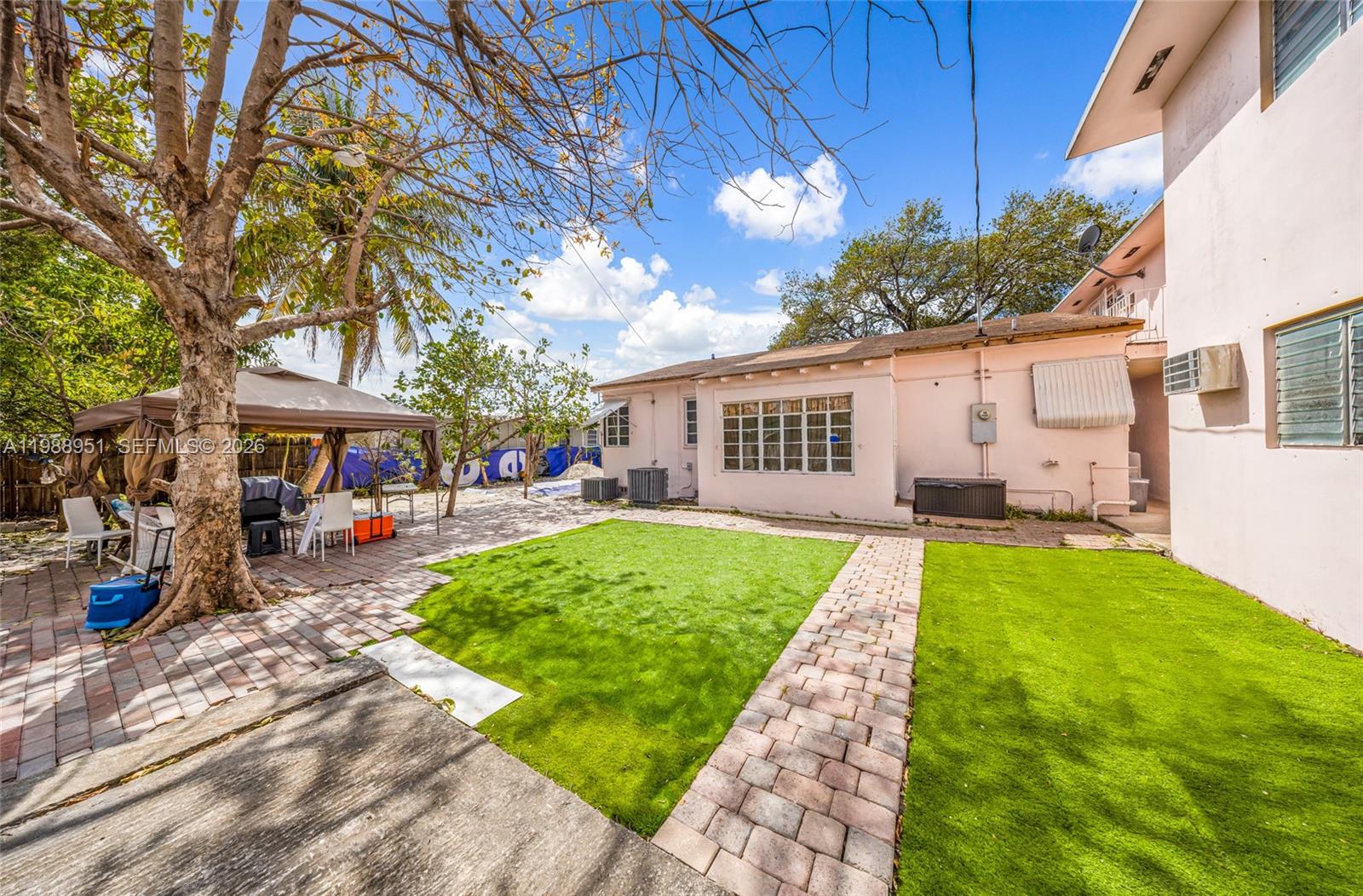 605 Northwest 34th Avenue Miami, FL 33125 - Photo 31 of 49 a front view of a house with garden