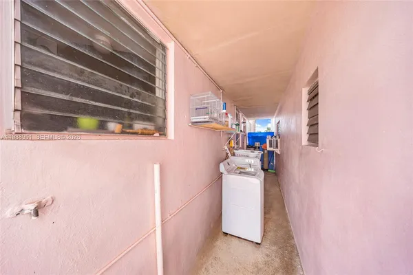 a view of a house with backyard porch and sitting area