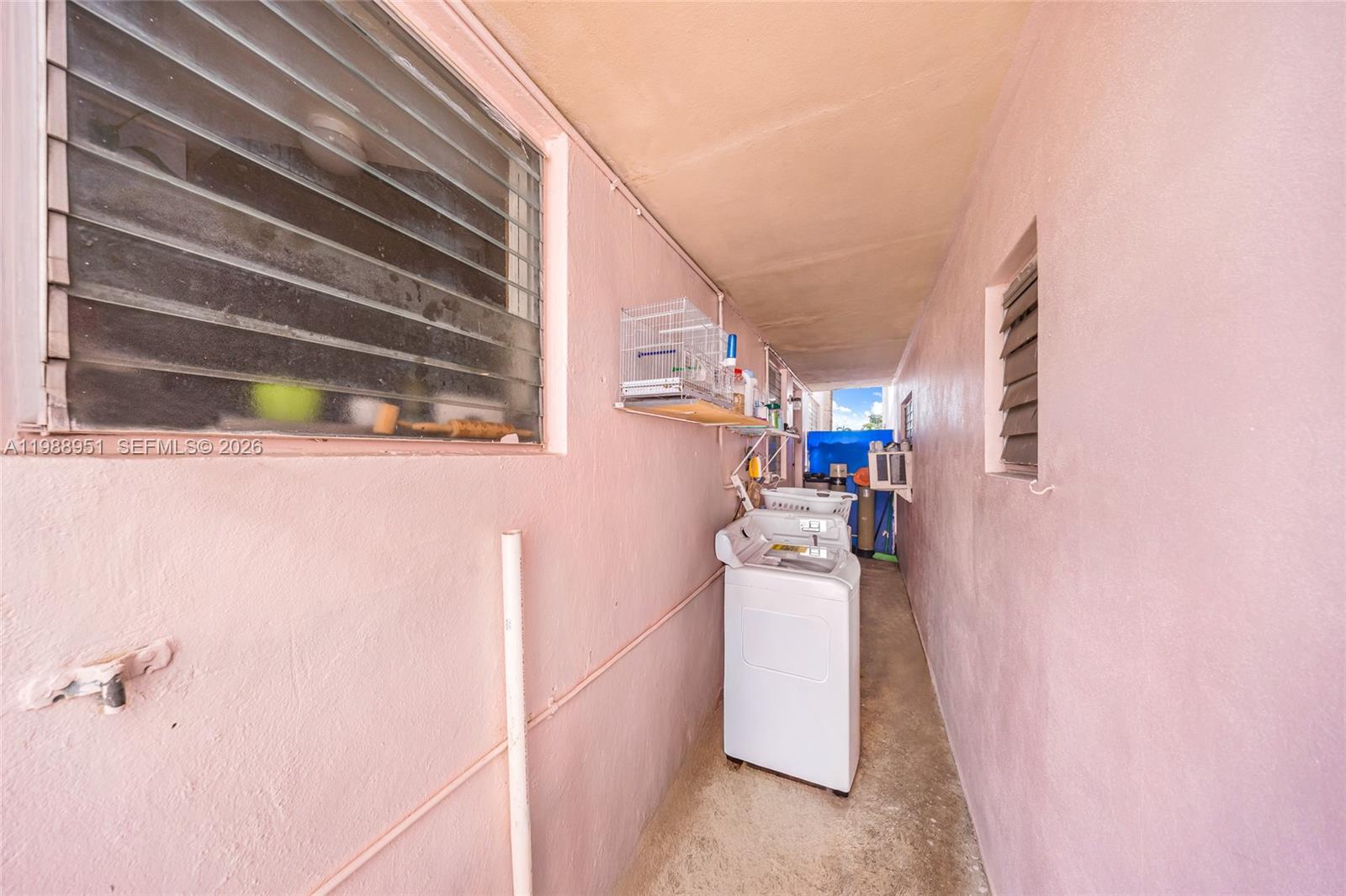 605 Northwest 34th Avenue Miami, FL 33125 - Photo 33 of 49 a utility room with dryer and washer