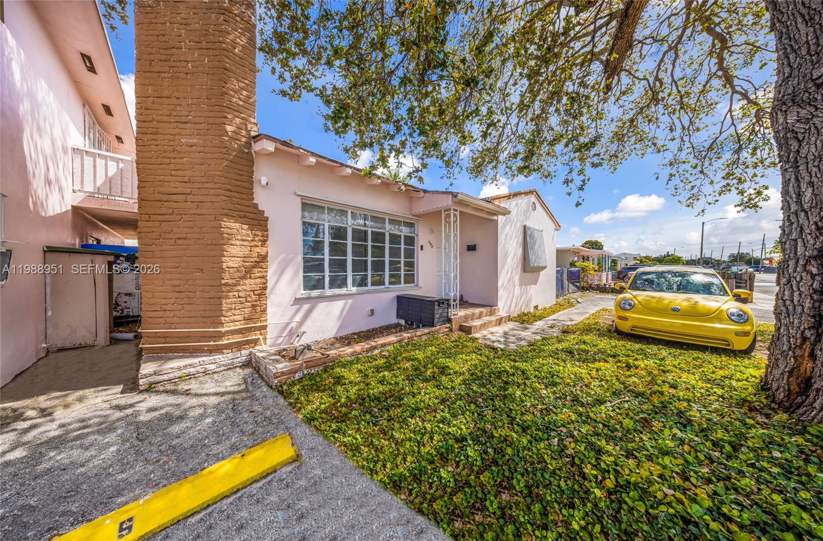 605 Northwest 34th Avenue Miami, FL 33125 - Photo 35 of 49 a view of a house with backyard and sitting area