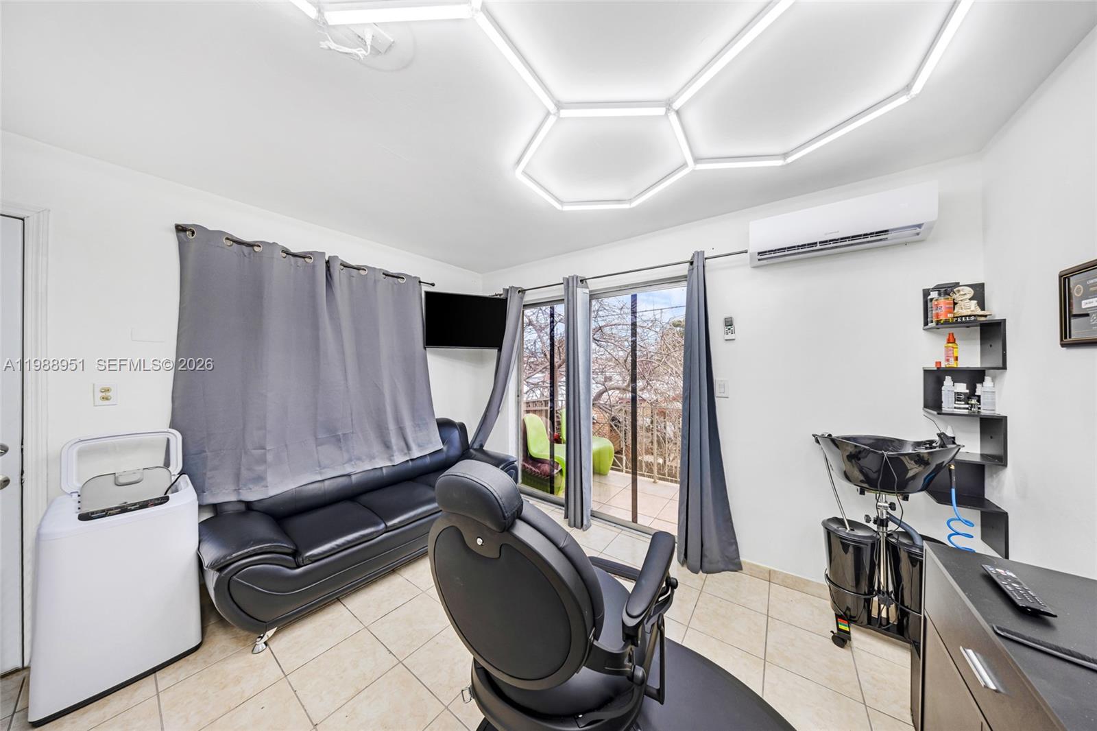 605 Northwest 34th Avenue Miami, FL 33125 - Photo 38 of 49 a room with furniture and a window