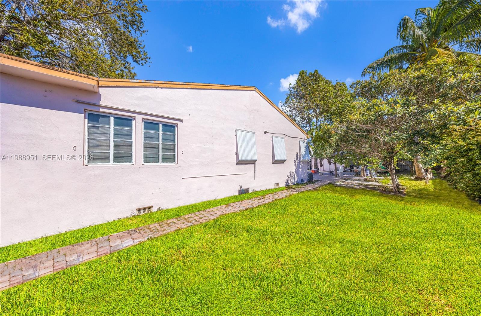 605 Northwest 34th Avenue Miami, FL 33125 - Photo 4 of 49 a view of a house with a backyard