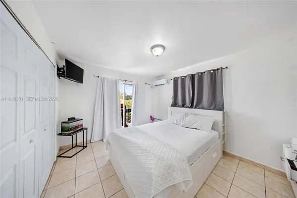 a bedroom with a bed and a closet