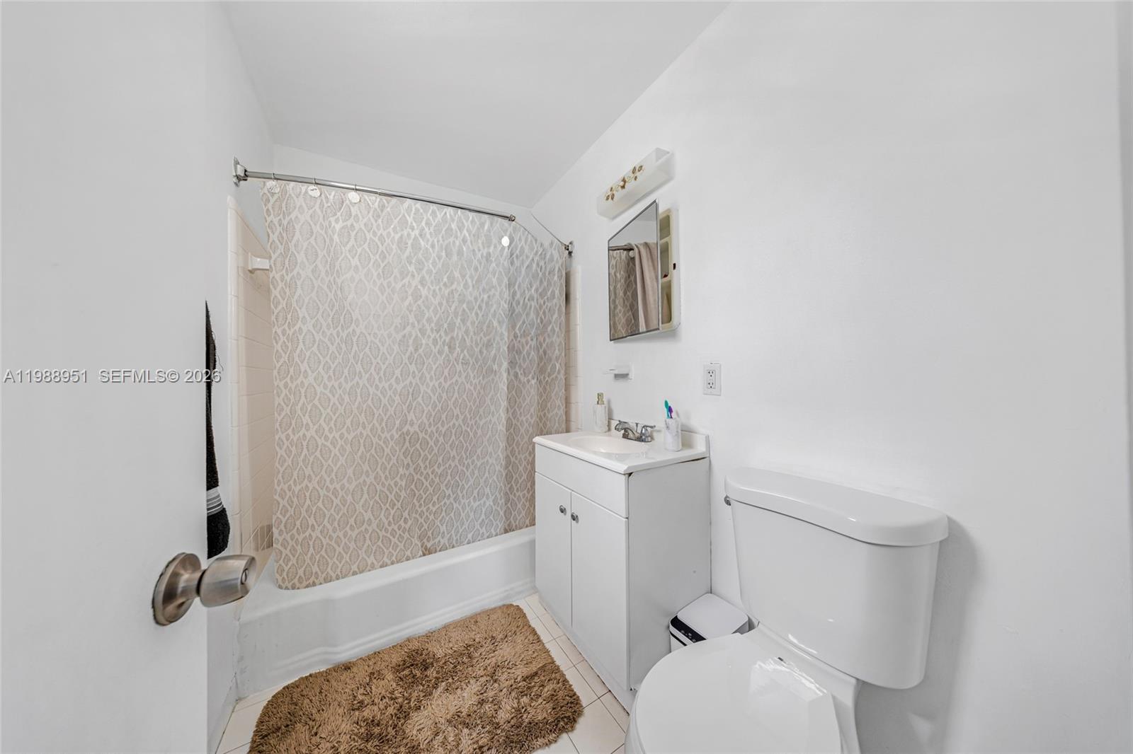 605 Northwest 34th Avenue Miami, FL 33125 - Photo 49 of 49 a bathroom with a sink a toilet and shower
