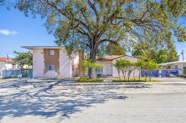 a house with trees in front of it