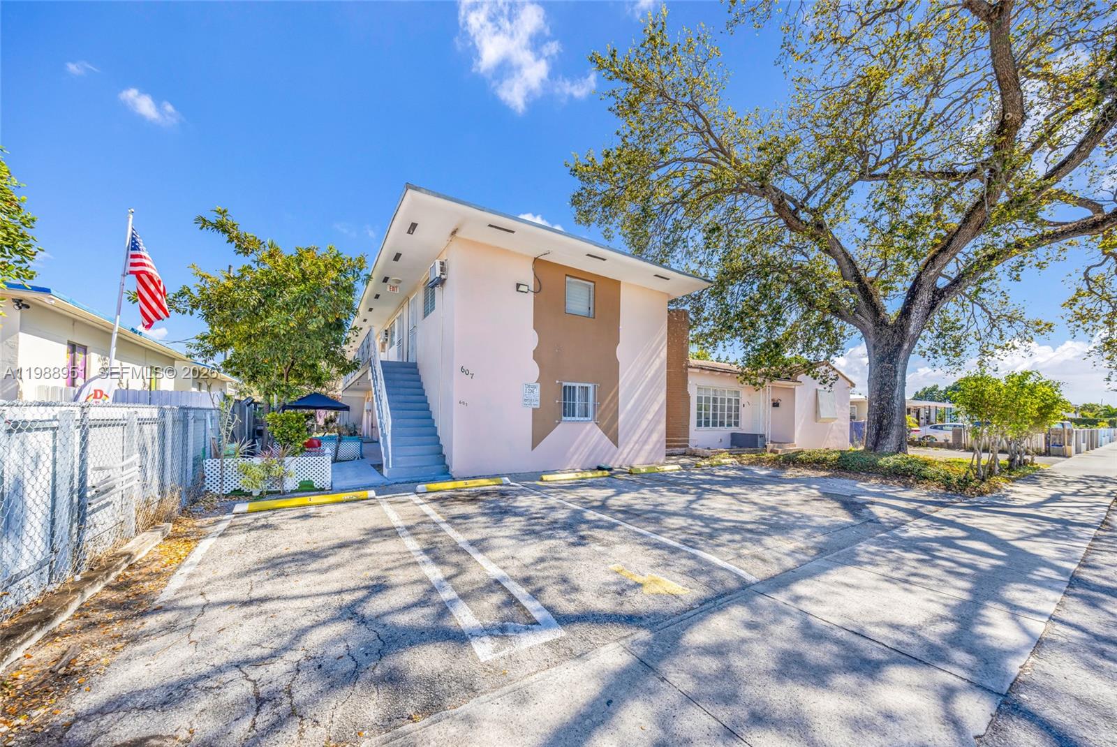 605 Northwest 34th Avenue Miami, FL 33125 - Photo 6 of 49 a view of a house with a snow in the yard