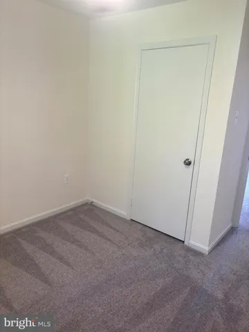 a bathroom with a sink toilet and mirror