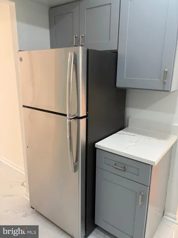 a bathroom with a toilet a sink a vanity and mirror