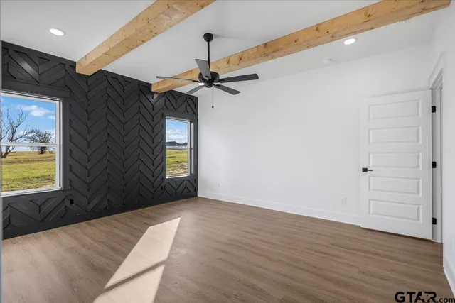 a bathroom with a double vanity sink mirror and bathtub