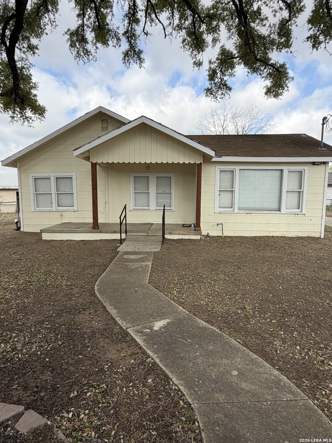719 Kelly Street Poteet, TX 78065 - Photo 4 of 12 front view of house with a yard