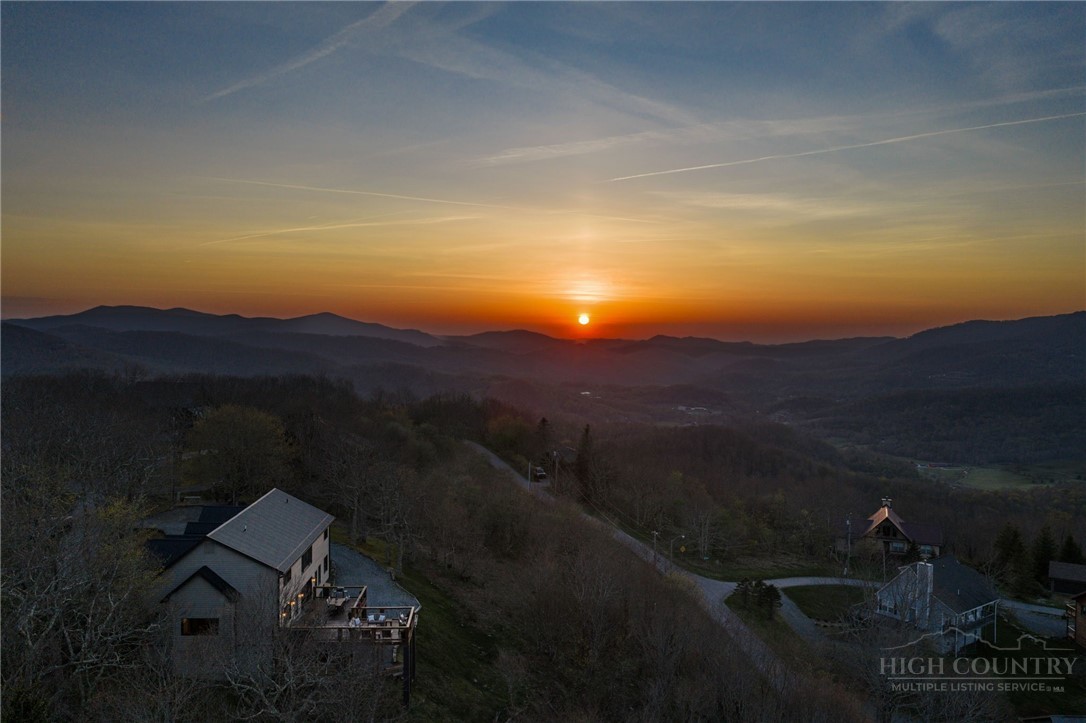 351 Windy Knob Trail Seven Devils, NC 28604 - Photo 42 of 50 a view of sunset and a yard