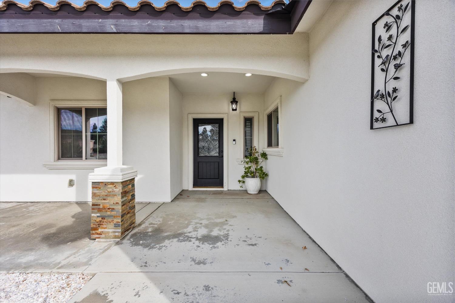 Undisclosed Address Tehachapi, CA 93561 - Photo 14 of 62 a view of a entryway door front of a house