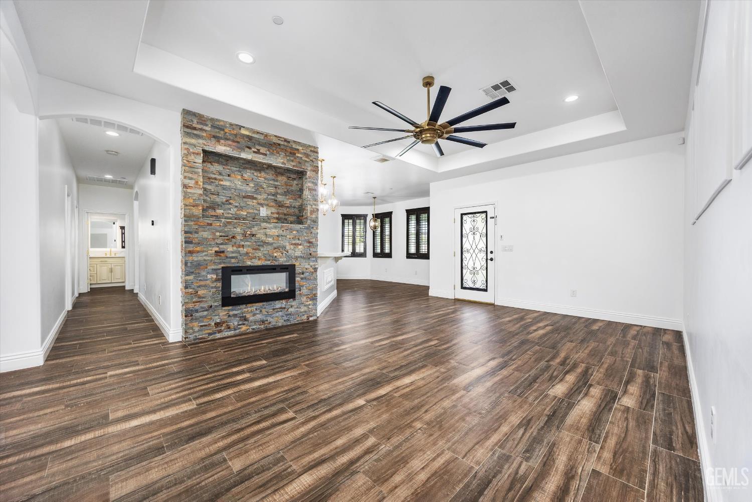 Undisclosed Address Tehachapi, CA 93561 - Photo 19 of 62 a view of a livingroom with wooden floor and a fireplace