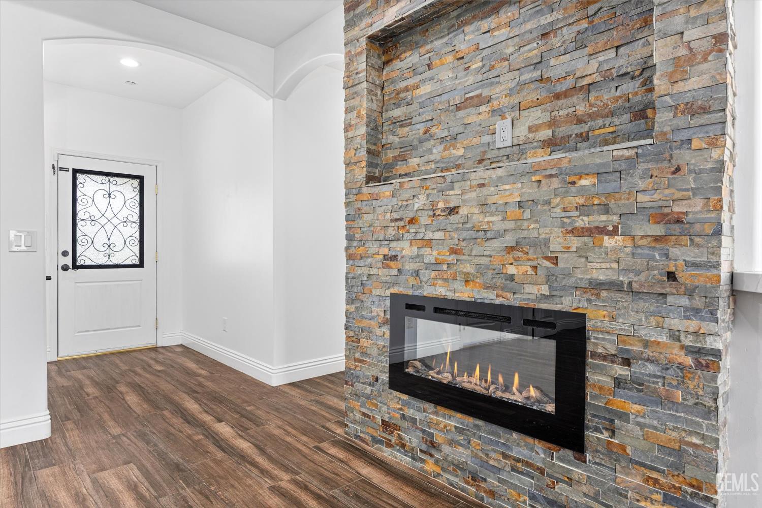 Undisclosed Address Tehachapi, CA 93561 - Photo 21 of 62 a living room with a fireplace