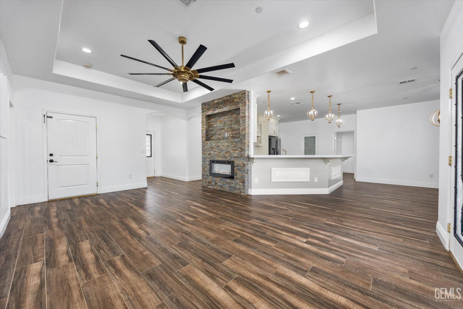 Undisclosed Address Tehachapi, CA 93561 - Photo 22 of 62 a view of a kitchen with wooden floor and a ceiling fan