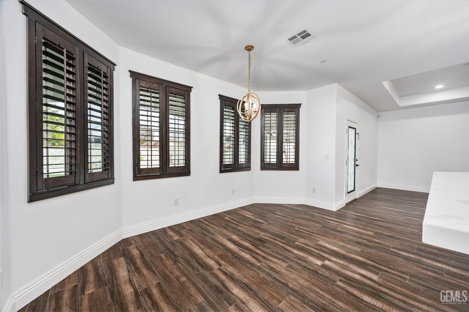 Undisclosed Address Tehachapi, CA 93561 - Photo 26 of 62 a view of an empty room with wooden floor and a window