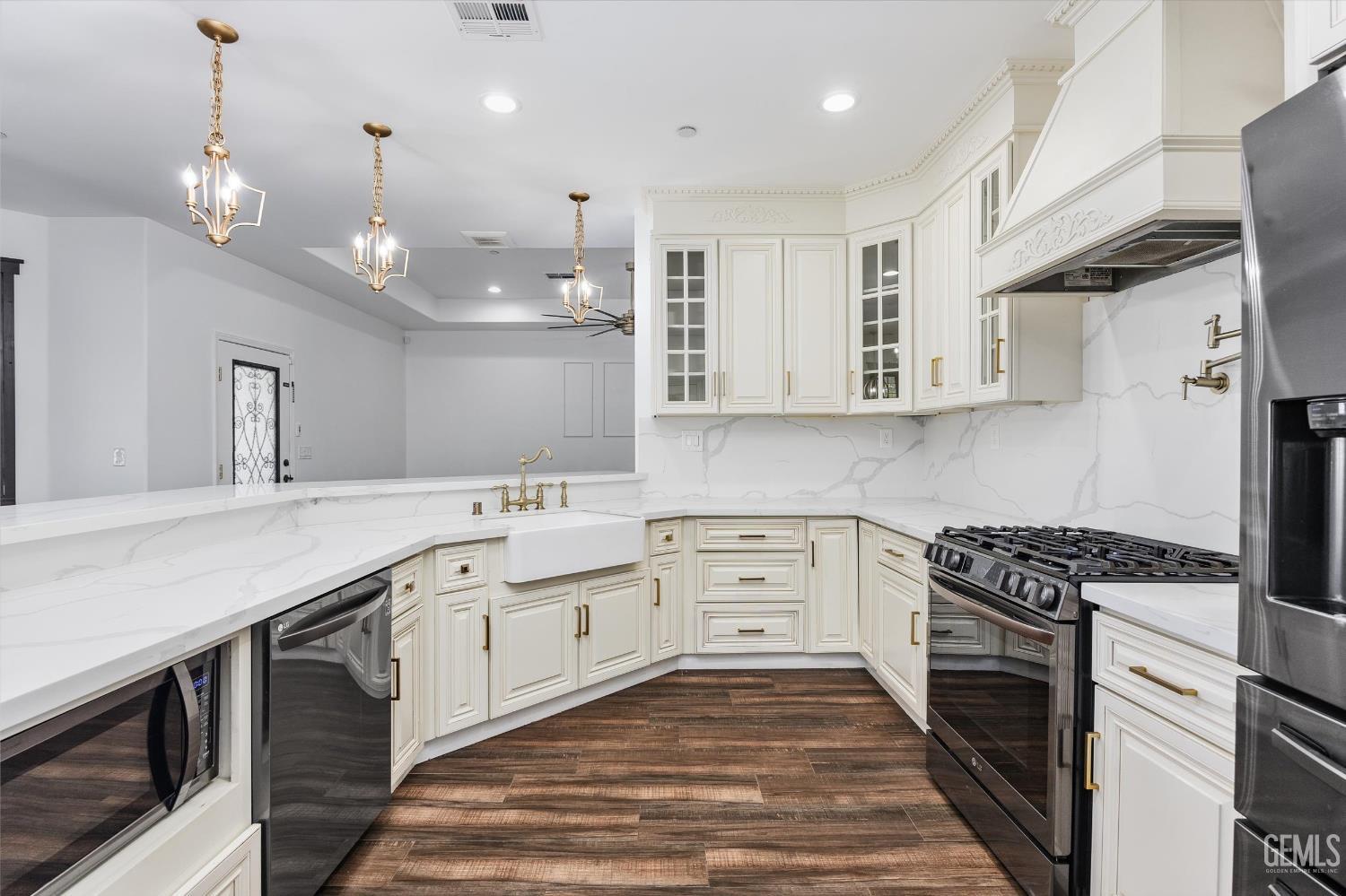 Undisclosed Address Tehachapi, CA 93561 - Photo 29 of 62 a kitchen with stainless steel appliances granite countertop a sink a stove and a refrigerator