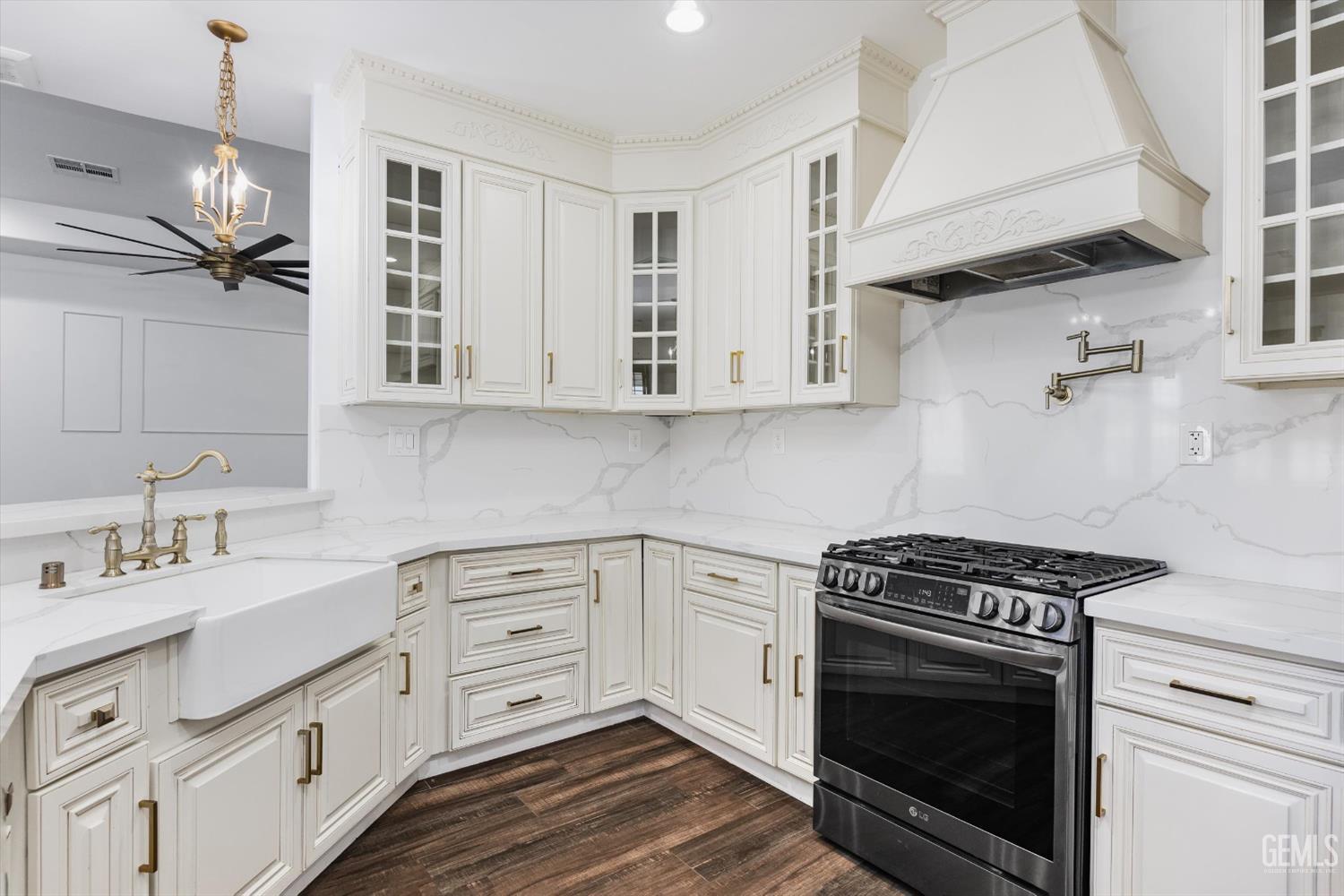 Undisclosed Address Tehachapi, CA 93561 - Photo 30 of 62 a kitchen with cabinets appliances a sink and a counter top space