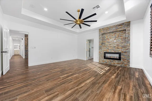a spacious bathroom with double vanity sink a mirror and a shower