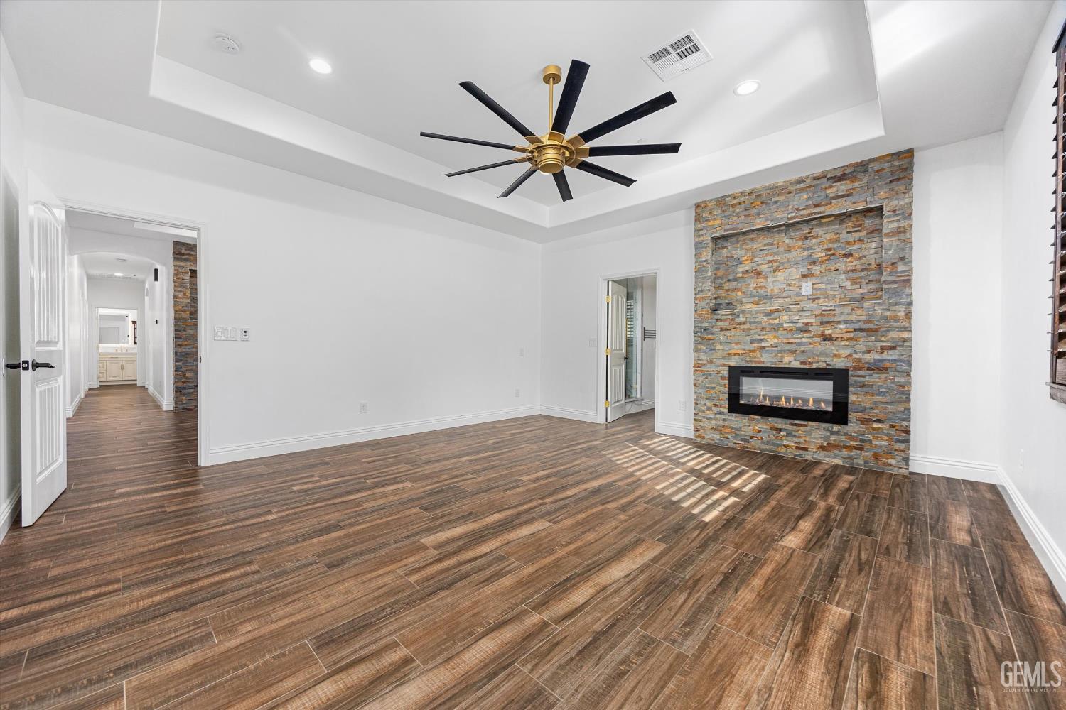 Undisclosed Address Tehachapi, CA 93561 - Photo 36 of 62 a view of empty room with wooden floor and fireplace