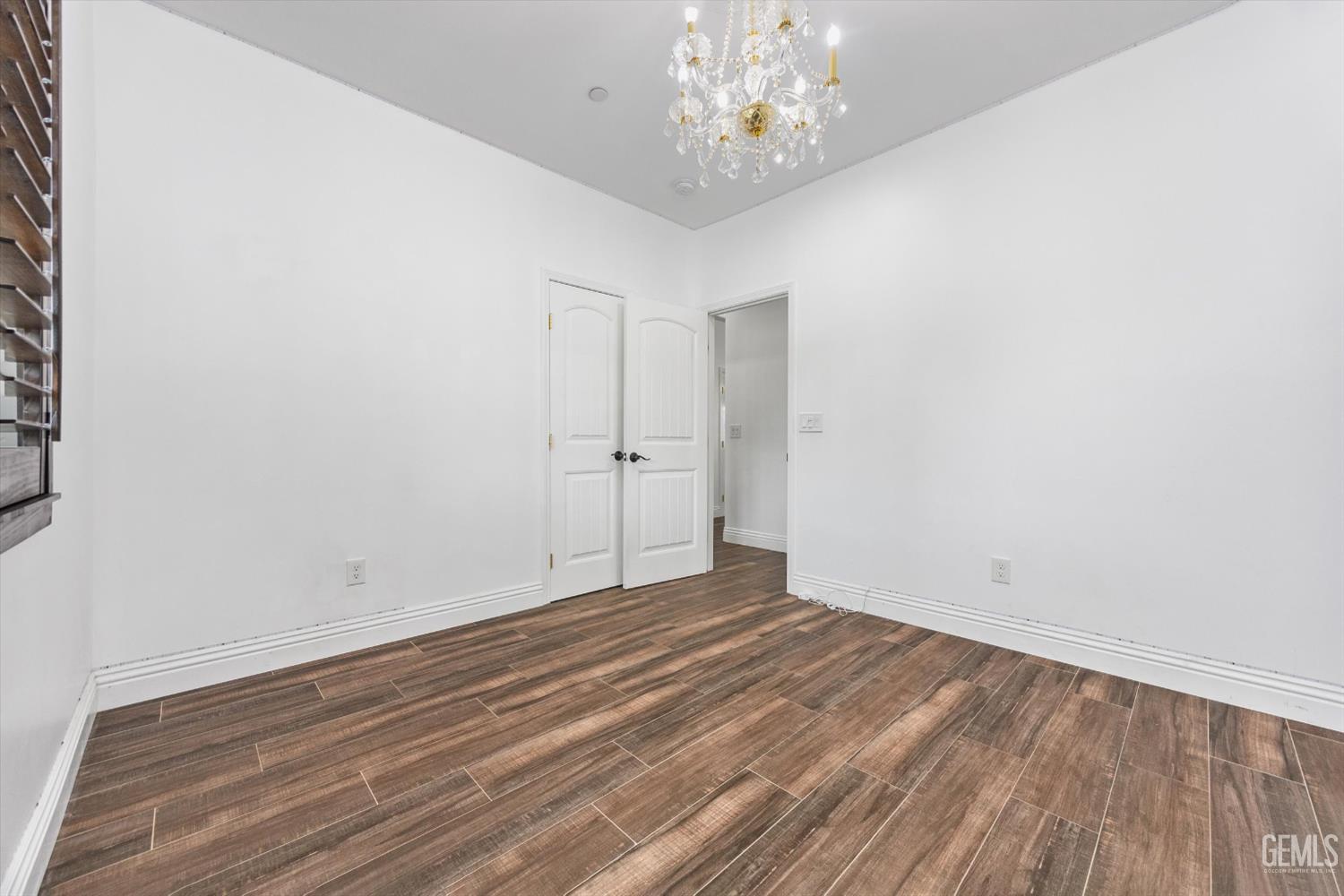 Undisclosed Address Tehachapi, CA 93561 - Photo 42 of 62 a view of an empty room with wooden floor