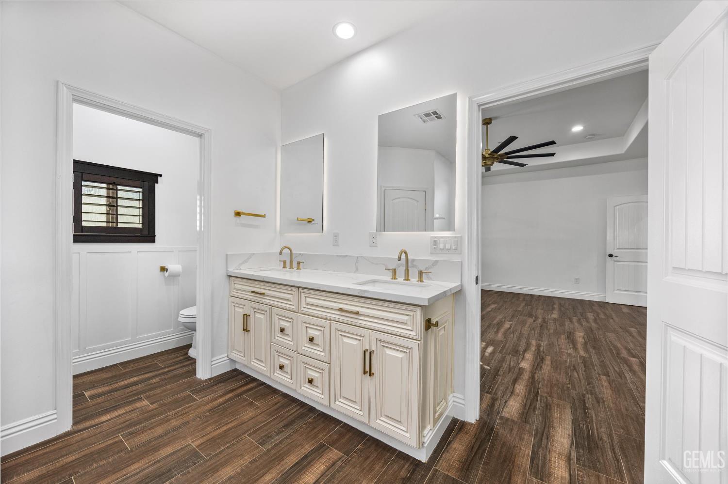 Undisclosed Address Tehachapi, CA 93561 - Photo 43 of 62 a spacious bathroom with double vanity sink a mirror and a shower