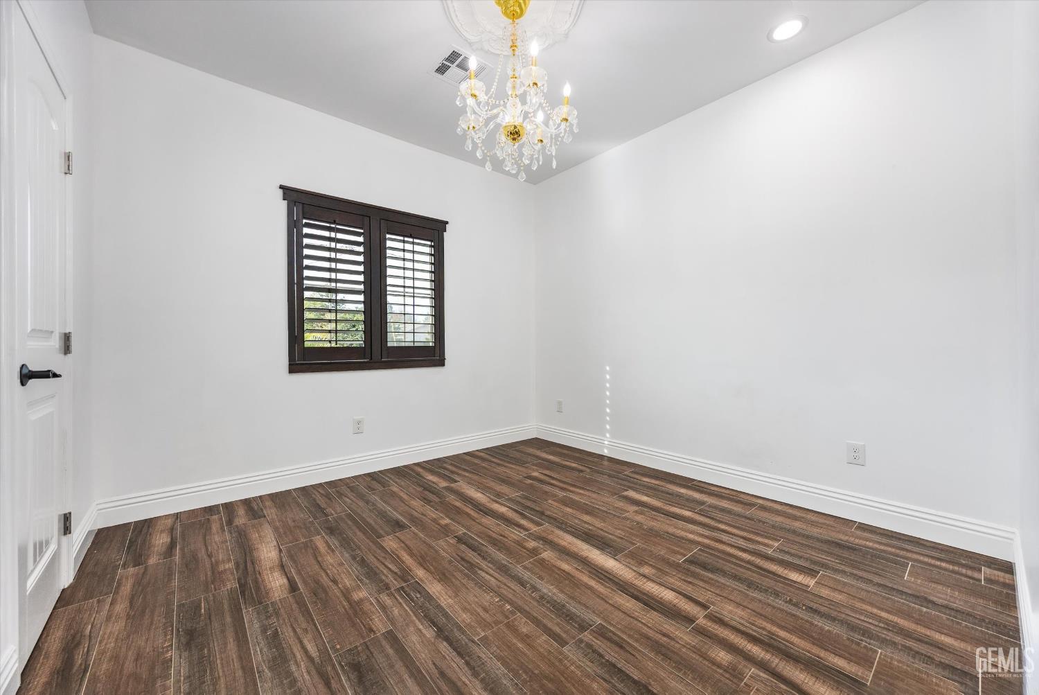 Undisclosed Address Tehachapi, CA 93561 - Photo 44 of 62 wooden floor in an empty room with a window