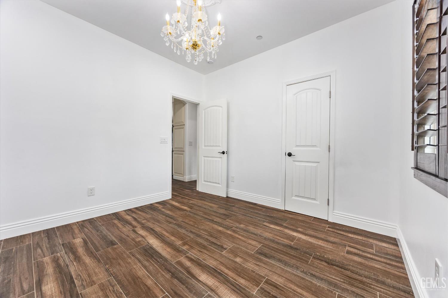 Undisclosed Address Tehachapi, CA 93561 - Photo 45 of 62 a view of an empty room with wooden floor