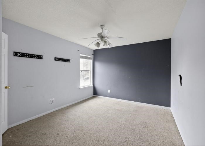 4922 Redwing Brook Trail Katy, TX 77449 - Photo 13 of 22 a view of an empty room with a window