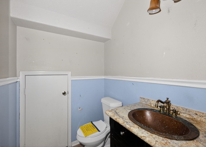 4922 Redwing Brook Trail Katy, TX 77449 - Photo 16 of 22 a bathroom with a sink a toilet and a mirror