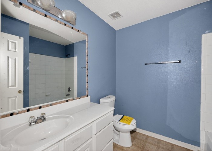 4922 Redwing Brook Trail Katy, TX 77449 - Photo 22 of 22 a bathroom with a sink a toilet and a mirror