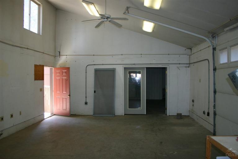 19129 Pumice Butte Road Bend, OR 97702 - Photo 11 of 18 a view of empty room with windows