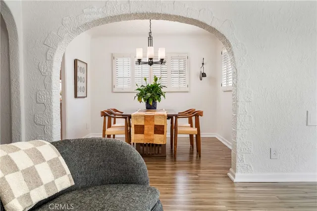 a bedroom with furniture and wooden floor