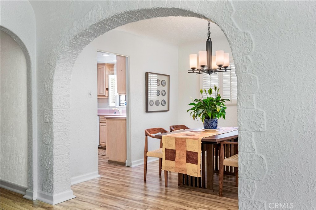 143 Roycroft Avenue Long Beach, CA 90803 - Photo 12 of 45 a dining room with furniture and wooden floor