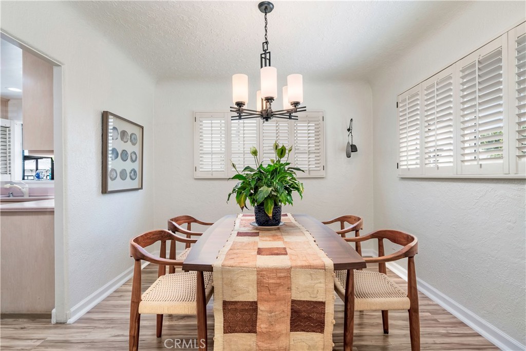 143 Roycroft Avenue Long Beach, CA 90803 - Photo 13 of 45 a view of a dining room with furniture window and wooden floor