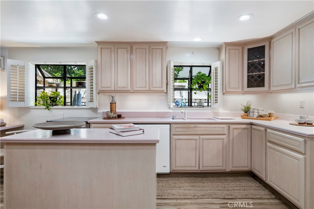 143 Roycroft Avenue Long Beach, CA 90803 - Photo 15 of 45 a kitchen with stainless steel appliances granite countertop a sink stove and cabinets