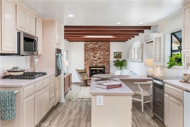 a kitchen with a stove a sink and a refrigerator