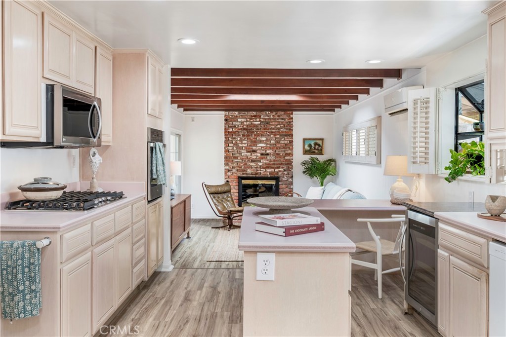 143 Roycroft Avenue Long Beach, CA 90803 - Photo 16 of 45 a kitchen with a stove a sink and a refrigerator