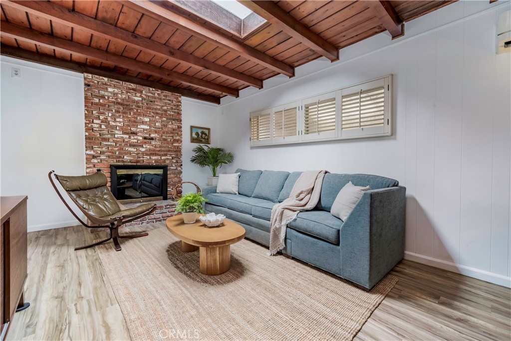143 Roycroft Avenue Long Beach, CA 90803 - Photo 20 of 45 a living room with furniture and a wooden floor
